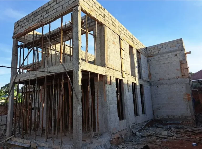 Two-storey block building with formwork and props on a residential site
