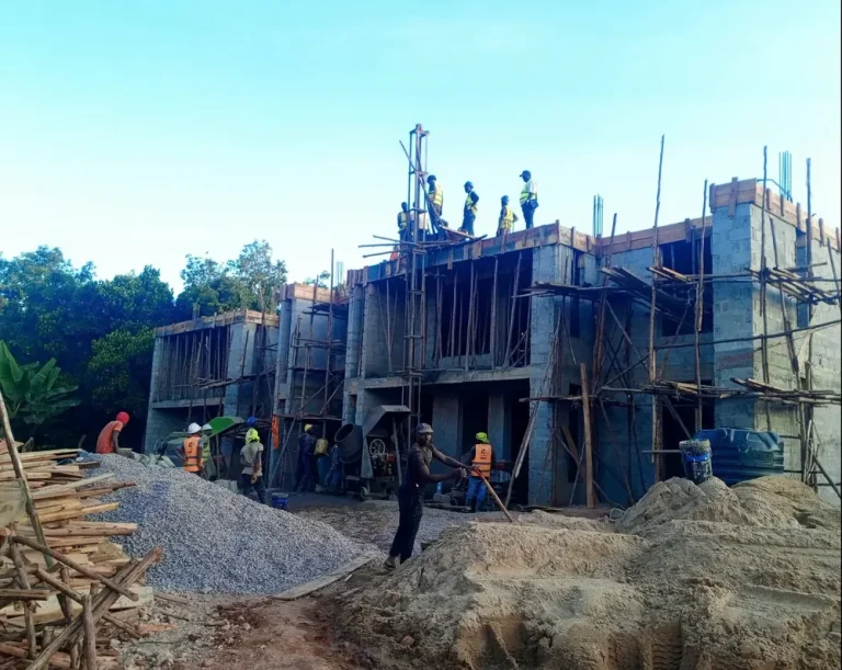 Workers on a multi-storey residential building under construction