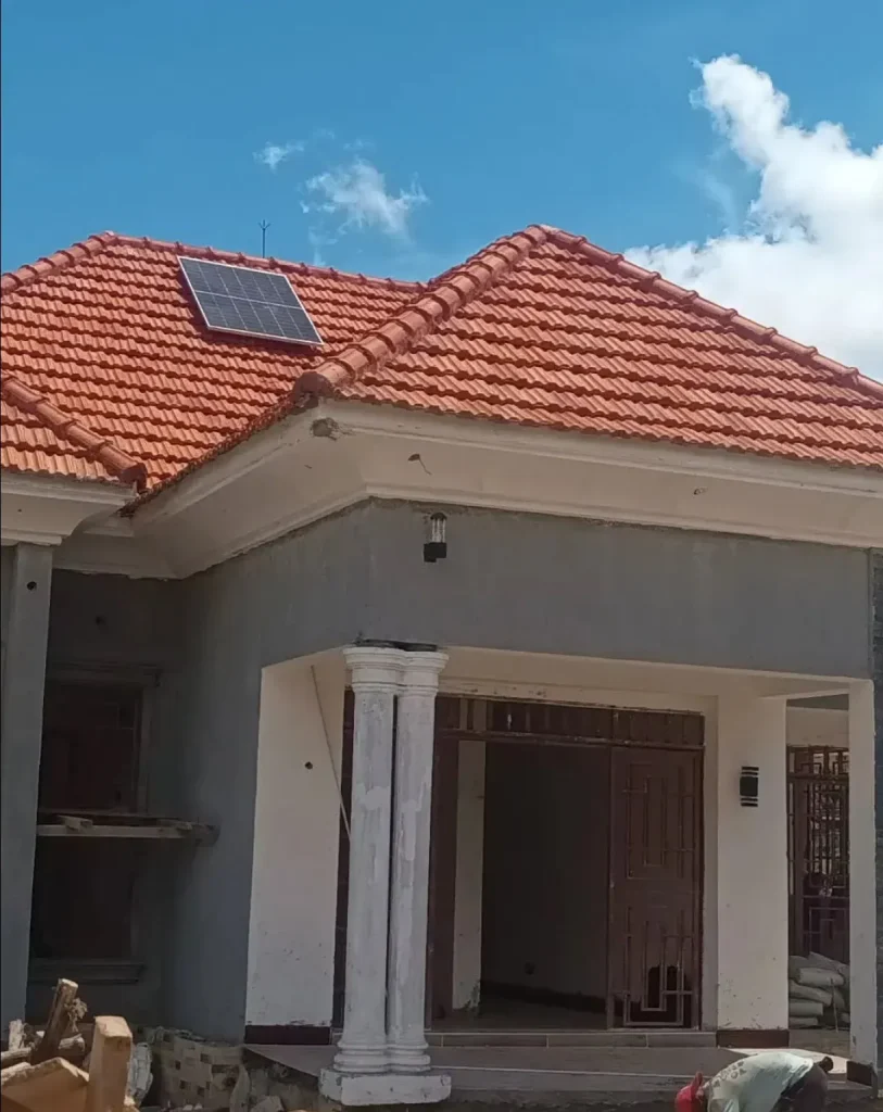 Tiled hip roof with a solar panel on a finished house