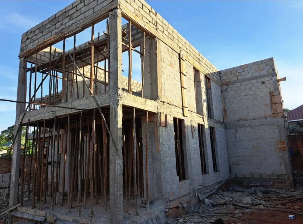 Block house with a concrete frame and timber formwork